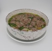 S72 Reisbandnudelsuppe mit Rindfleisch und Kräutern